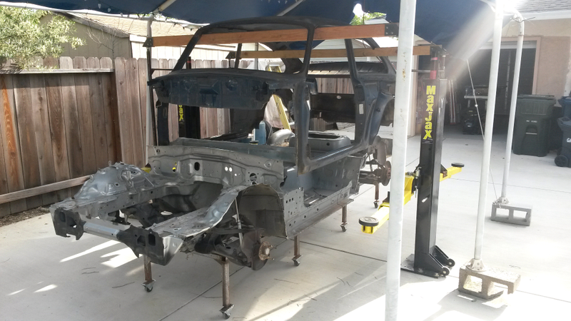 Lowering everything down on the custom rig, which makes use of a regular two-post lift to raise and lower the body.